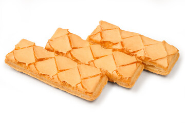 Three sweet biscuits with jam on a white background. Puff pastry on a white background with a shadow.