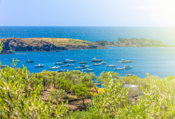 View of motor boats in the bay and the roof of Salvador Dali's house in soft sunlight