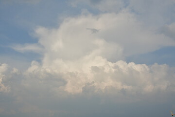 Fototapeta na wymiar Big cumulus clouds befor summer rain with sunlight