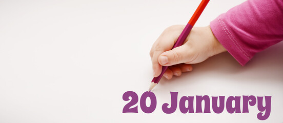 A child's hand writes 20 january in a lilac pencil. Banner with copy space