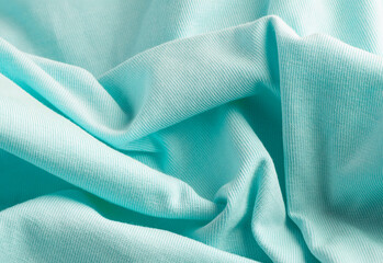 Turquesa color summer t shirt texture, close up of fabric cloth swatch