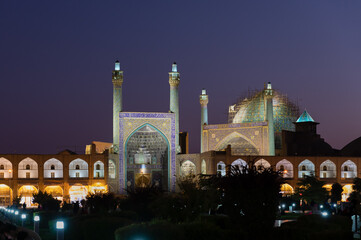 Fototapeta na wymiar Historical Shah Mosque at night on south side of Naghsh-e Jahan Square, Isfahan, Iran. UNESCO World Heritage. Architectural masterpiece.
