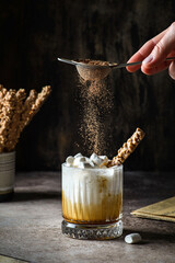 milk with caramel on a dark background