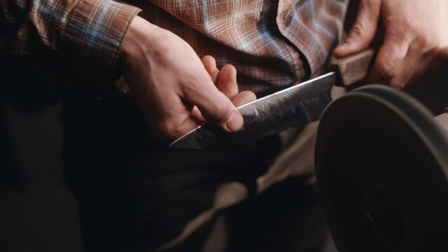 Griding and forging knife by blacksmith