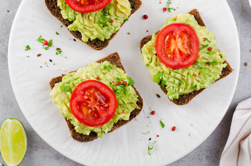 Avocado Toasts with Tomato, Healthy Snack or Breakfast on Bright Background