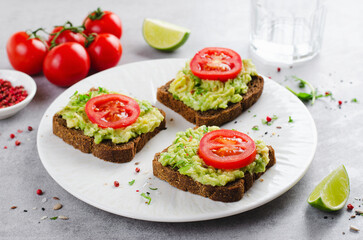 Avocado Toasts with Tomato, Healthy Snack or Breakfast on Bright Background