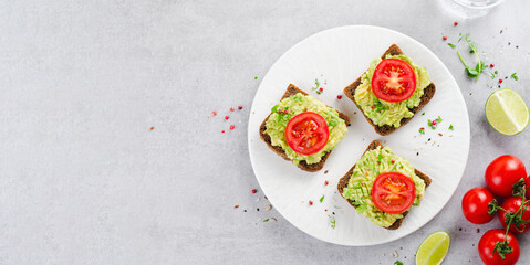 Avocado Toasts with Tomato, Healthy Snack or Breakfast on Bright Background