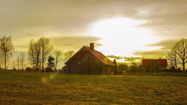 A timelapse footage of a barnyard on a sunset.