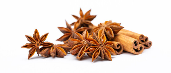 Star anise and cinnamon sticks on a white background isolated. Indian spices close up. Medicinal herbs and spices.