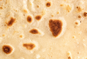 Pan fried pancake as a background.