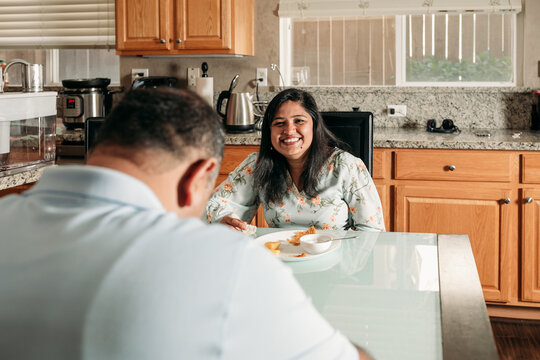 South Asian couple cooking in the Kitchen