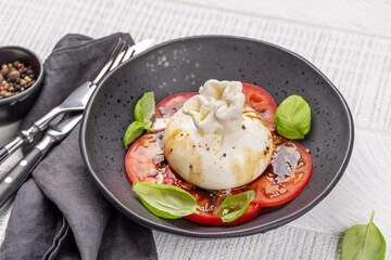 Burrata cheese, tomatoes and basil