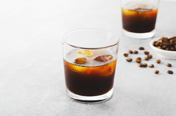 Iced Coffee, Cold Brew Coffee with Ice on Bright Background, Coffee Cocktail, Refreshing Beverage