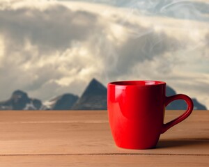 Obraz premium Tasty hot tea in cup in the sunrise background.