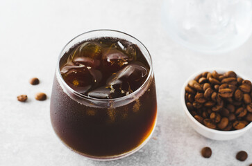Iced Coffee, Cold Brew Coffee with Ice on Bright Background, Coffee Cocktail, Refreshing Beverage
