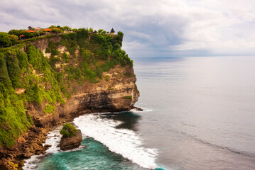 Uluwatu cliff on ocean coast on Bali island, Indonesia