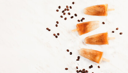 Coffee Popsicles, Refreshing Ice Lollies with Coffee Beans and Ice on Bright Background