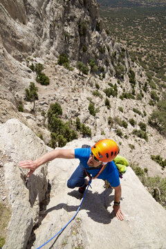 Climbing a free route in Palomera Peak in Spain