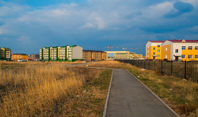 Fototapeta na wymiar New apartment buildings. kazakhstan (Ust-Kamenogorsk). New residential area. Bright modern architecture