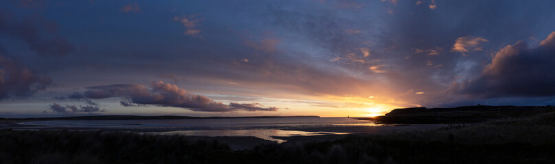 Naklejka na ściany i meble Sunset at Dunnet Head beach. North Sea coast. Sotland. Twilight. 