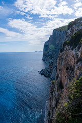 Fototapeta na wymiar Rock at the seashore. Rocky shore on the mediterranean sea. Sardinia, Italy