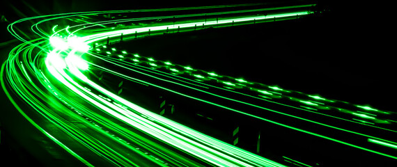 green lines of car lights on black background