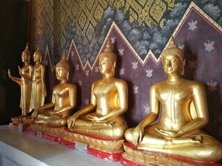 Buddha statue at the entrance gate of main chapel in Wat Phra Sri Rattana Mahathat, Phitsanulok...