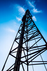 tower crane stake with blue sky and white clouds.