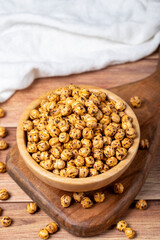 Roasted chickpea. Roasted chickpeas in wooden bowl. superfood Vegetarian food concept. healthy snacks. Close up