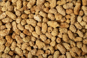 Dried mulberry. Sun-dried dried mulberry closeup food background. Top view. texture. copy space banner
