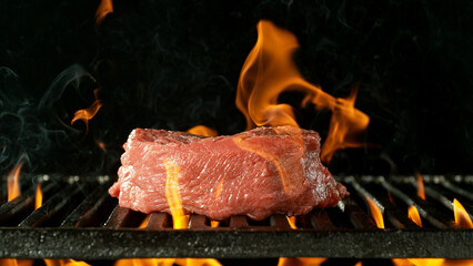 Barbecue Grill WIth Raw Beef Steak.
