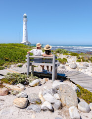 Couple men and women visiting the lighthouse of Slangkop Kommetjie Cape Town South Africa, The...