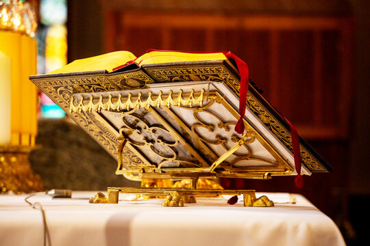 book of the catholic priest on the holy mass near the altar.