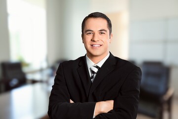 Fototapeta premium Portrait of the successful young male businessman in office building