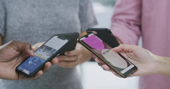 Phone, communication and data sharing with people standing in a huddle to connect to a mobile network. Contact, teamwork and information with hands closeup in a circle to search while cloud computing