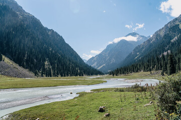 hiking in kyrgyzstan, the mountains Tian Shan, view with the river and mointains