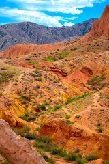 Obraz premium Natural unusual landscape red canyon of extraordinary beauty is similar to the Martian landscape. Multi-colored canyon fairy tale in Kyrgyzstan. Charyn Canyon. Amazing beautiful landscape.