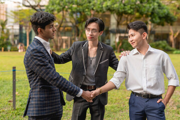 A young asian man gets two former friends and now enemies to shake hands, reconcile and call a...