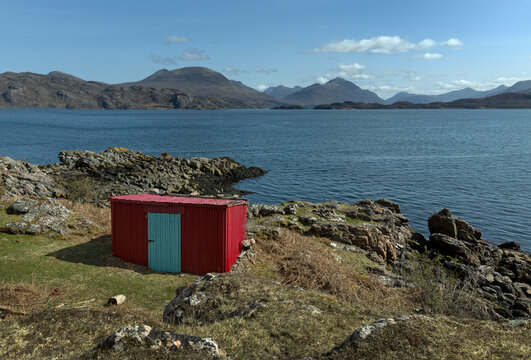 Loch Claira Scottish Highlands. Scotland. Lake.  Little red barn. Mountains.