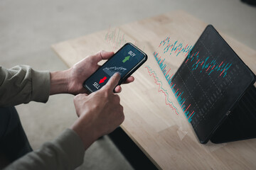 planning and strategy, Stock market, trader or investor working at home. Technical price graph and indicator, red and green candlestick chart and stock trading computer screen on hand.