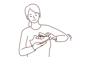 Smiling woman polish shoes with brush