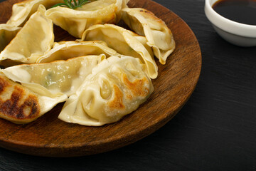 Gyoza Chinese Dumplings on Wood Plate, Fried Vegetable Jiaozi Macro, Chicken Momo Pile, Asian Gyoza...
