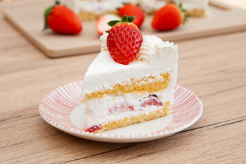 Slice of fresh strawberry shortcake with whipped cream, Japanese style