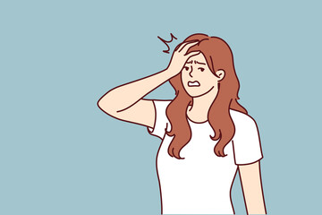 Irritated woman making face palm gesture after learning about delay in delivery from courier. Irritated girl puts hand on forehead showing anxiety and fatigue associated with psychological pressure