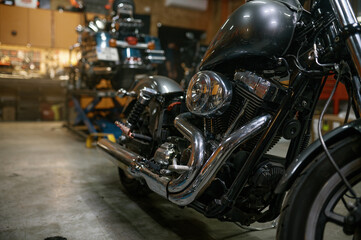 Shiny custom motorcycle after repair and restoration in workshop