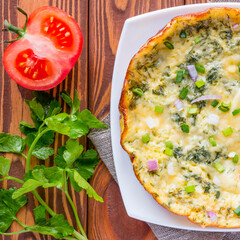 omelet on a white plate with vegetables