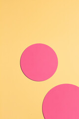 Paper yellow background with pink circles.