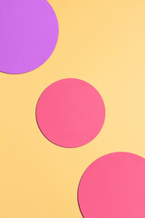 Paper yellow background with pink and purple circles.