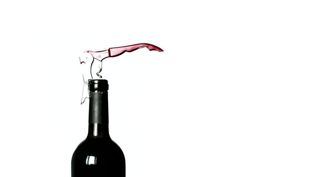 Opening a bottle of red wine with a corkscrew. Stop motion animation. Loop video