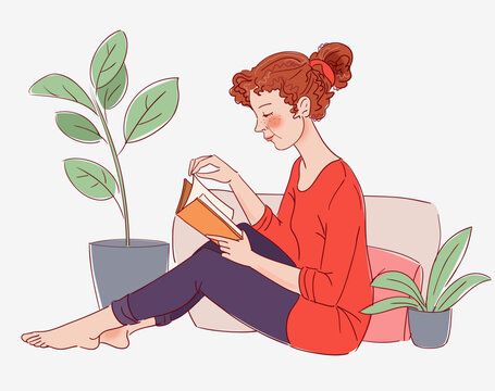Cute, young woman reading a book 
